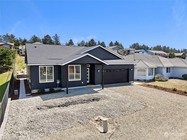 ranch-style home featuring a garage