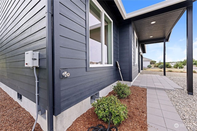 view of home's exterior featuring a patio and crawl space