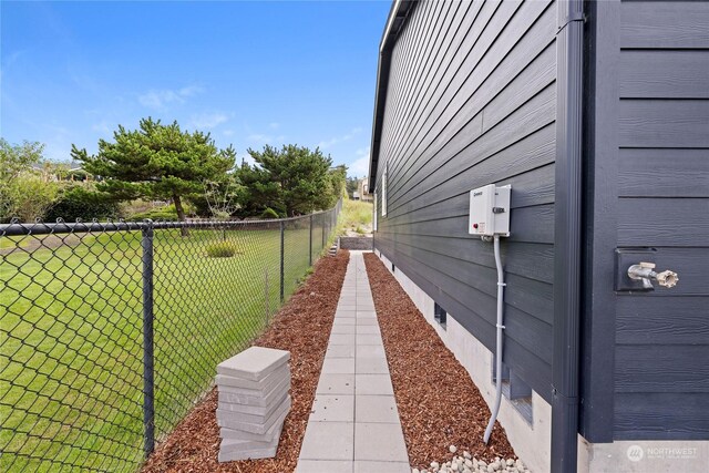 view of property exterior featuring a lawn