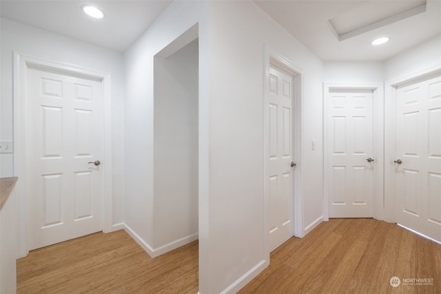 hall with light wood-type flooring