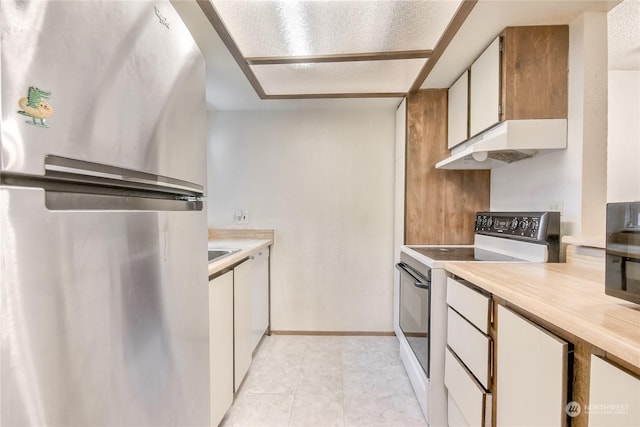 kitchen featuring under cabinet range hood, white cabinets, light countertops, freestanding refrigerator, and electric range oven