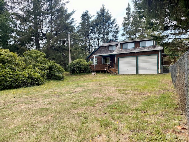 view of yard with a deck and a garage