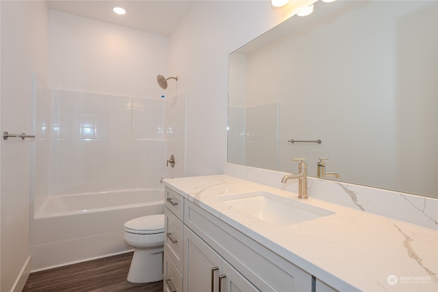 full bathroom featuring wood-type flooring, shower / tub combination, vanity, and toilet