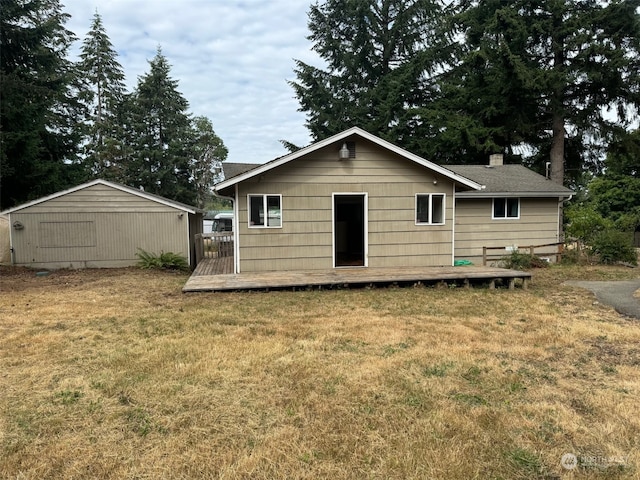 rear view of house with a lawn