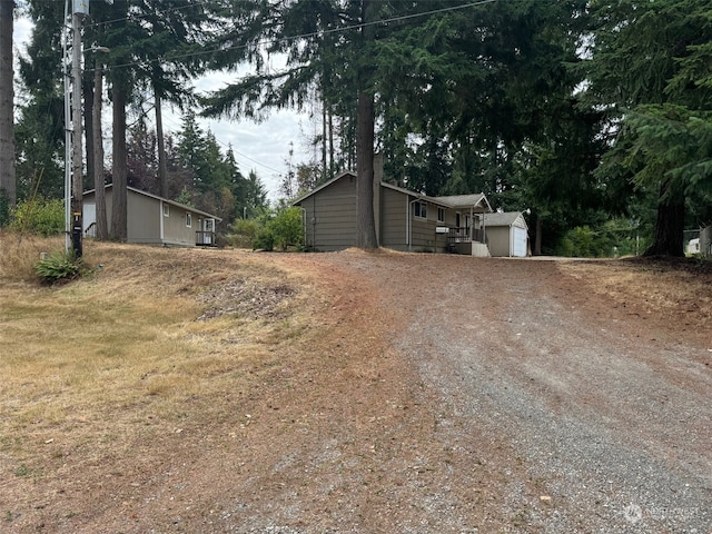 exterior space with a garage and an outdoor structure