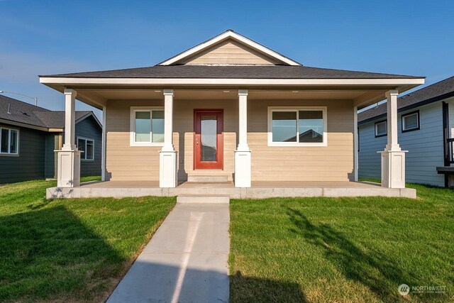 bungalow-style house with a porch and a front yard