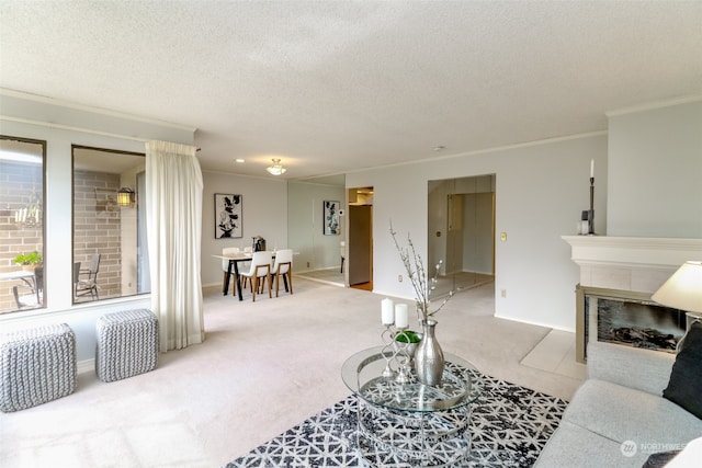 living room with crown molding, a textured ceiling, light carpet, and a fireplace