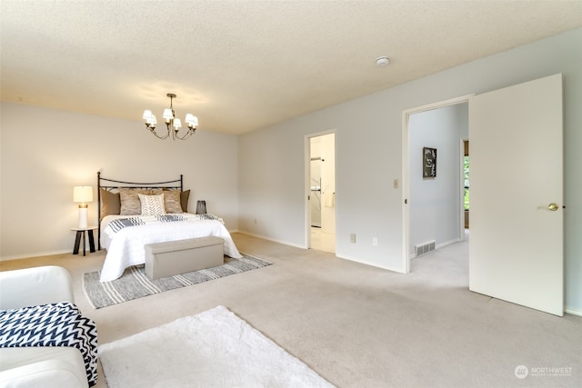 carpeted bedroom featuring a textured ceiling, a notable chandelier, and connected bathroom