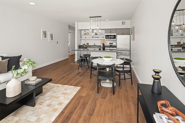 dining room featuring hardwood / wood-style flooring and sink