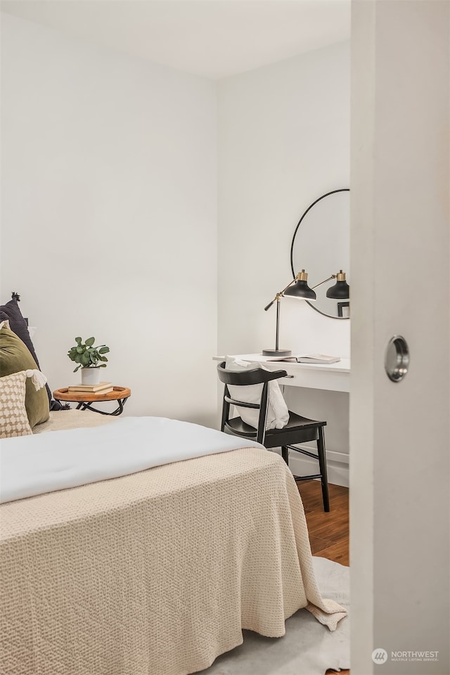 bedroom with wood-type flooring