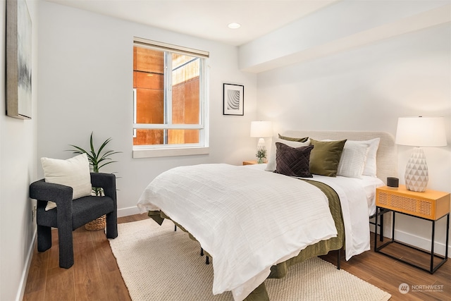 bedroom with hardwood / wood-style flooring