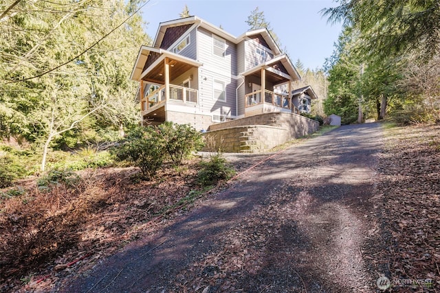 view of side of home with driveway