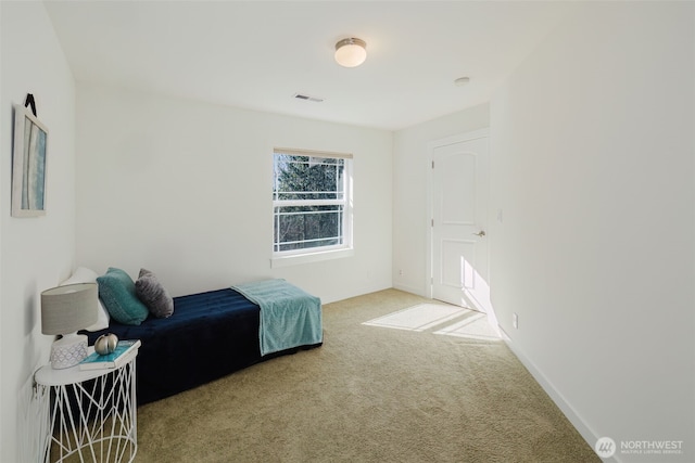 carpeted bedroom with baseboards