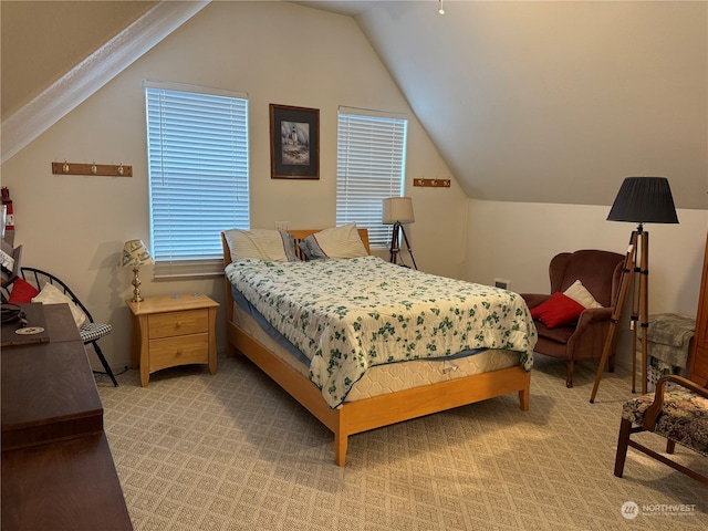 carpeted bedroom featuring vaulted ceiling