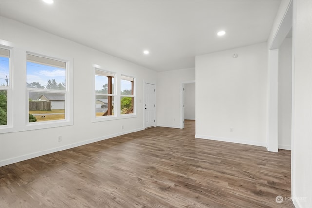 unfurnished room featuring dark hardwood / wood-style flooring