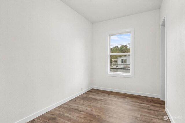 spare room featuring hardwood / wood-style flooring