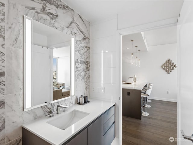 bathroom with vanity and wood finished floors