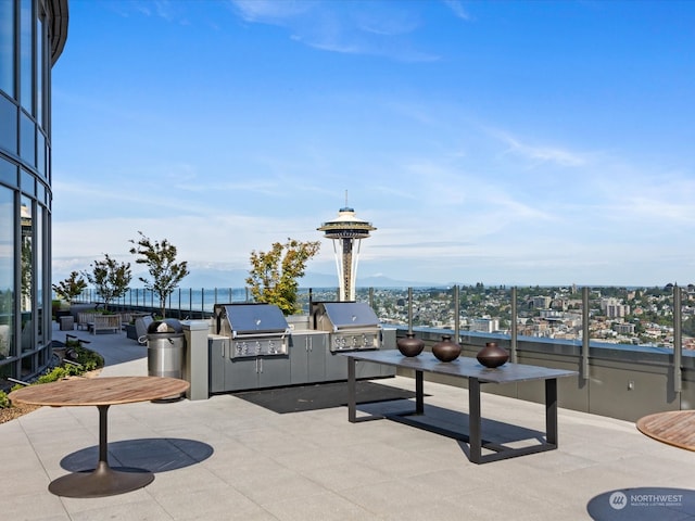 view of patio with a water view, grilling area, and area for grilling