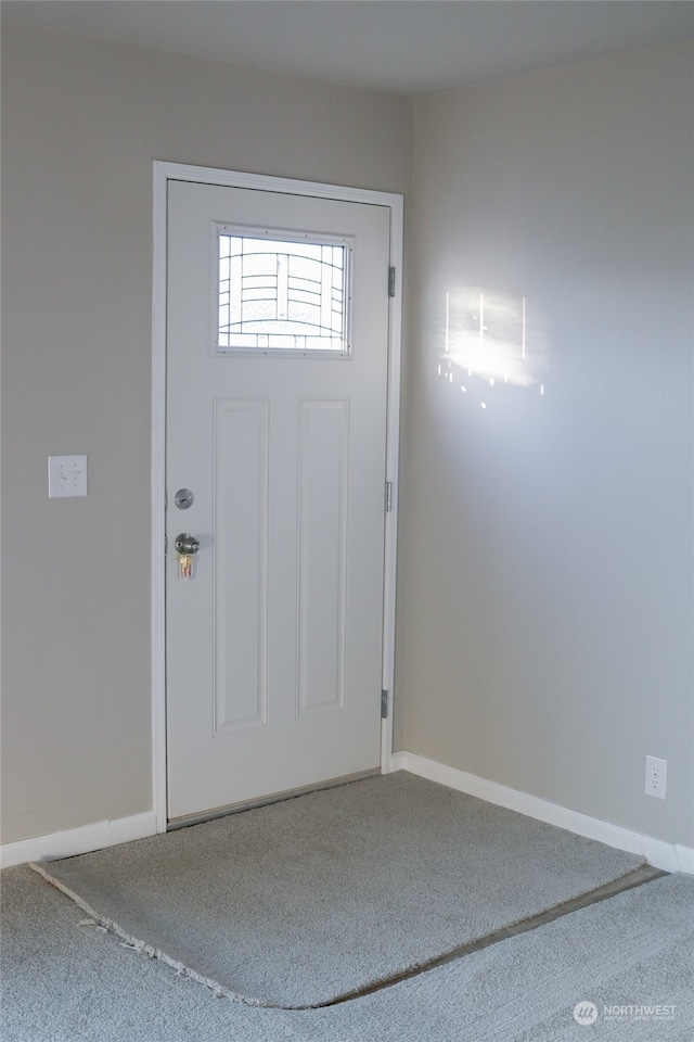 view of carpeted foyer