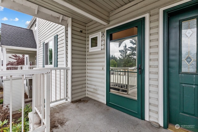 property entrance featuring covered porch