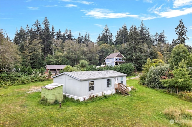 view of property exterior featuring a lawn