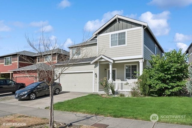 view of front of property with a porch, a garage, concrete driveway, board and batten siding, and a front yard