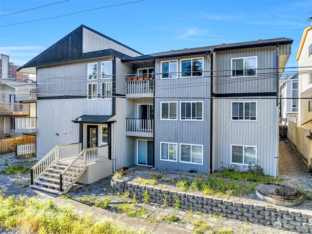 back of property with a balcony