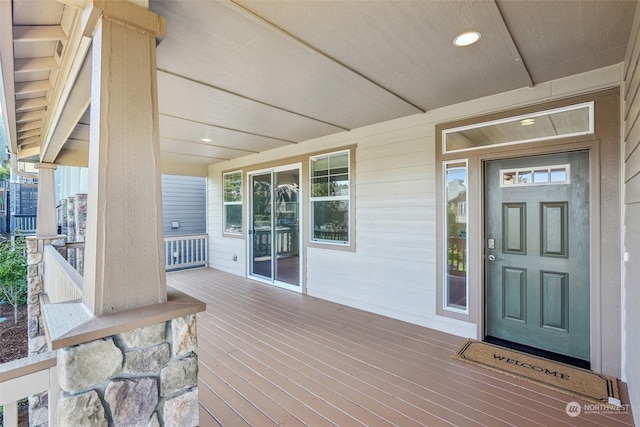 wooden terrace featuring covered porch