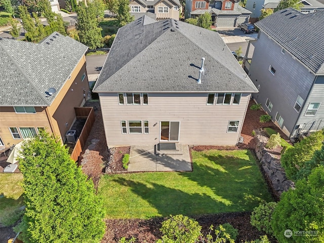 birds eye view of property with a residential view