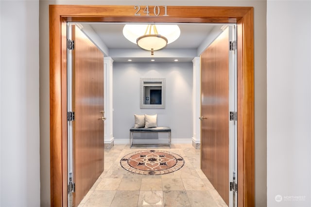 hall featuring tile patterned floors