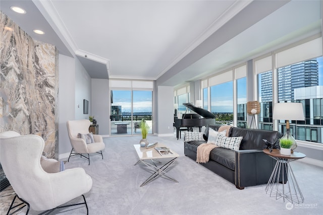 carpeted living room featuring expansive windows and ornamental molding