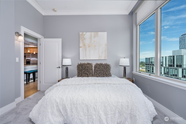 carpeted bedroom featuring stainless steel fridge and ornamental molding