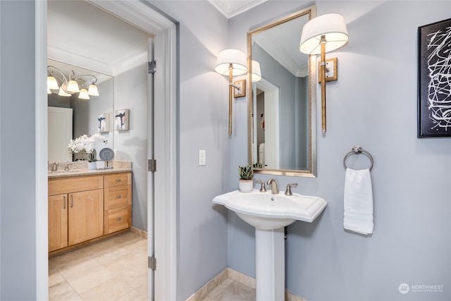 bathroom featuring sink, ornamental molding, and tile patterned flooring