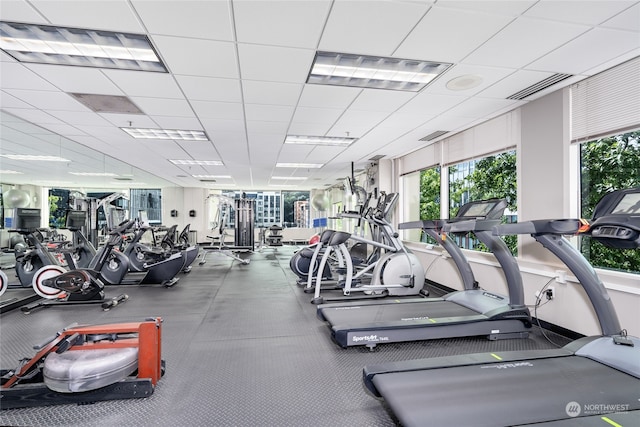 exercise room featuring a paneled ceiling