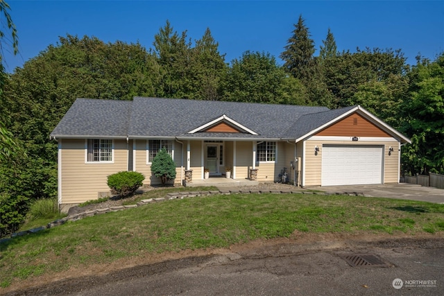 ranch-style house with a garage and a front yard