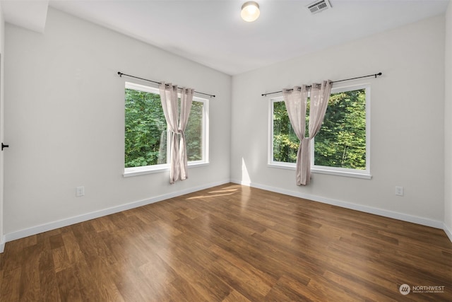 empty room featuring dark hardwood / wood-style floors