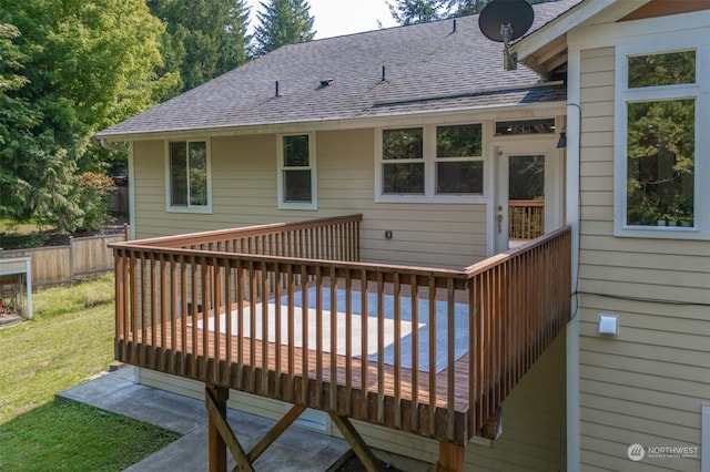 wooden deck featuring a yard