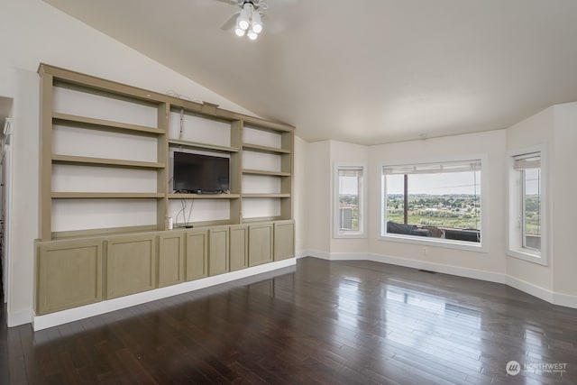 unfurnished living room featuring lofted ceiling and dark hardwood / wood-style flooring