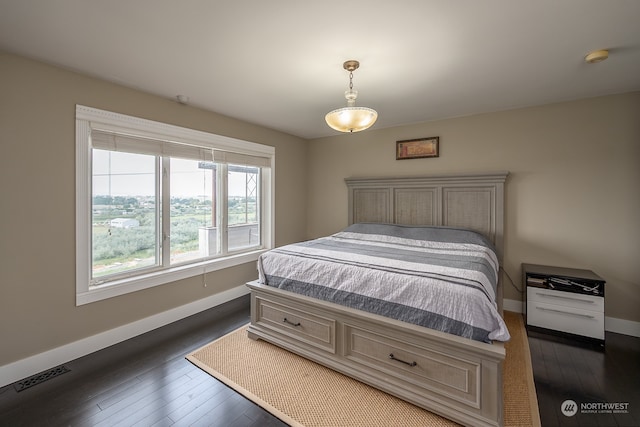 bedroom featuring dark hardwood / wood-style floors