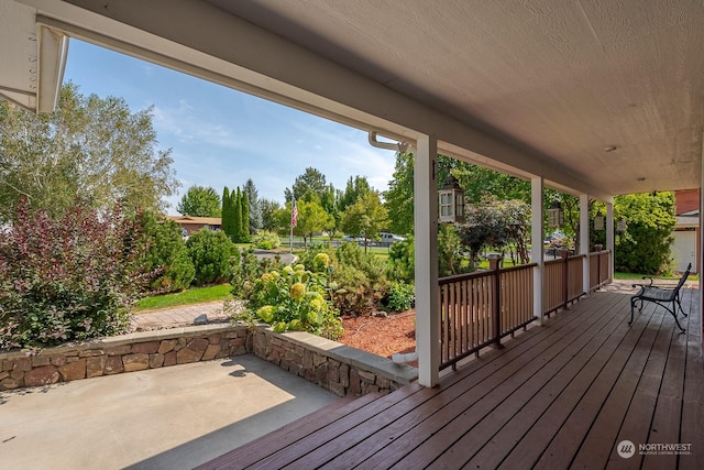 wooden deck with a patio area