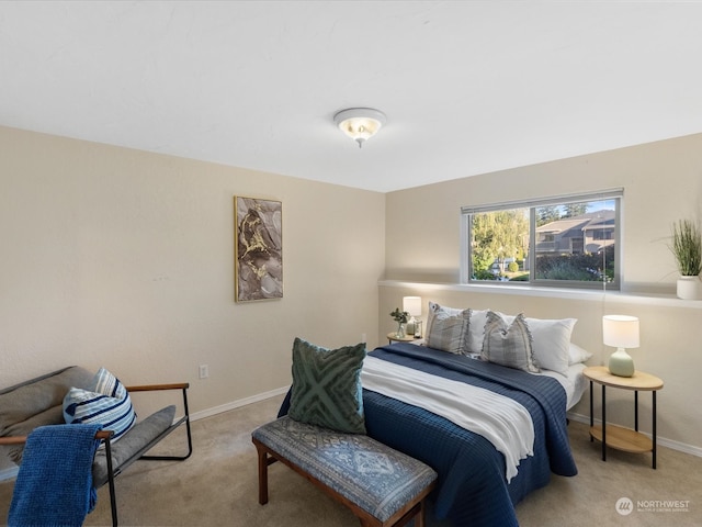 bedroom featuring light carpet