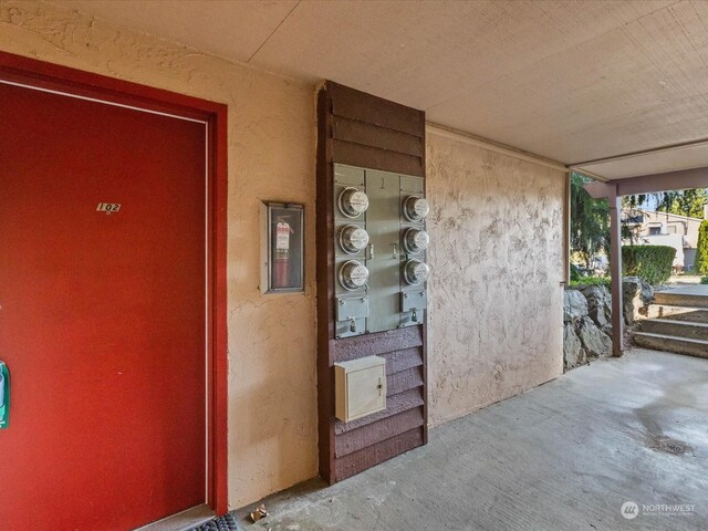 property entrance featuring stucco siding