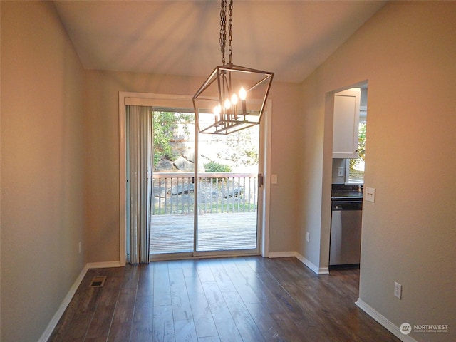 unfurnished dining area with dark wood-style floors, visible vents, vaulted ceiling, a chandelier, and baseboards