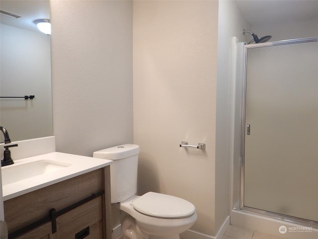 bathroom featuring visible vents, toilet, a stall shower, vanity, and tile patterned flooring