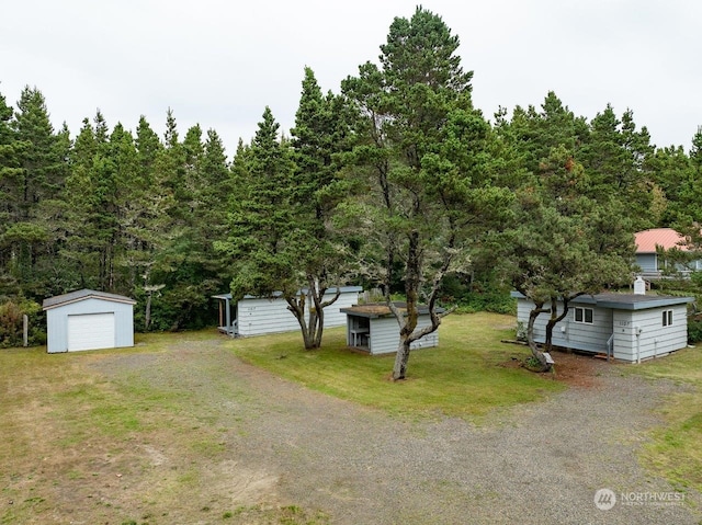 exterior space with an outdoor structure and a garage