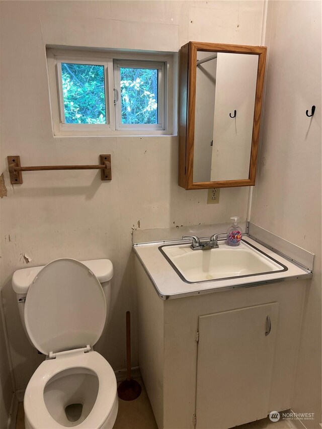 bathroom with vanity and toilet