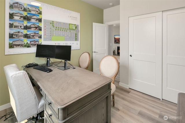 home office with light wood-type flooring