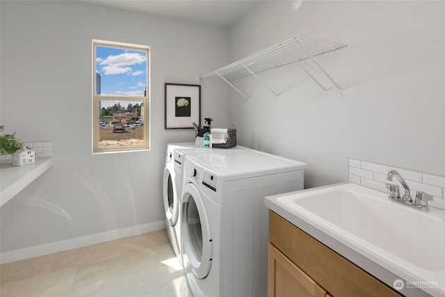 laundry room featuring sink and separate washer and dryer