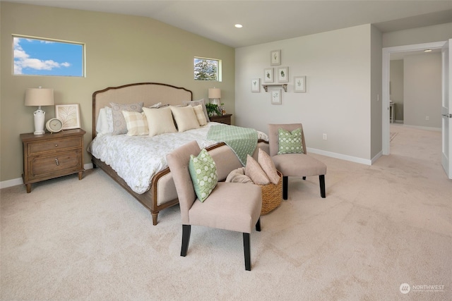 carpeted bedroom with multiple windows and vaulted ceiling