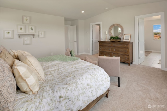 carpeted bedroom with vaulted ceiling